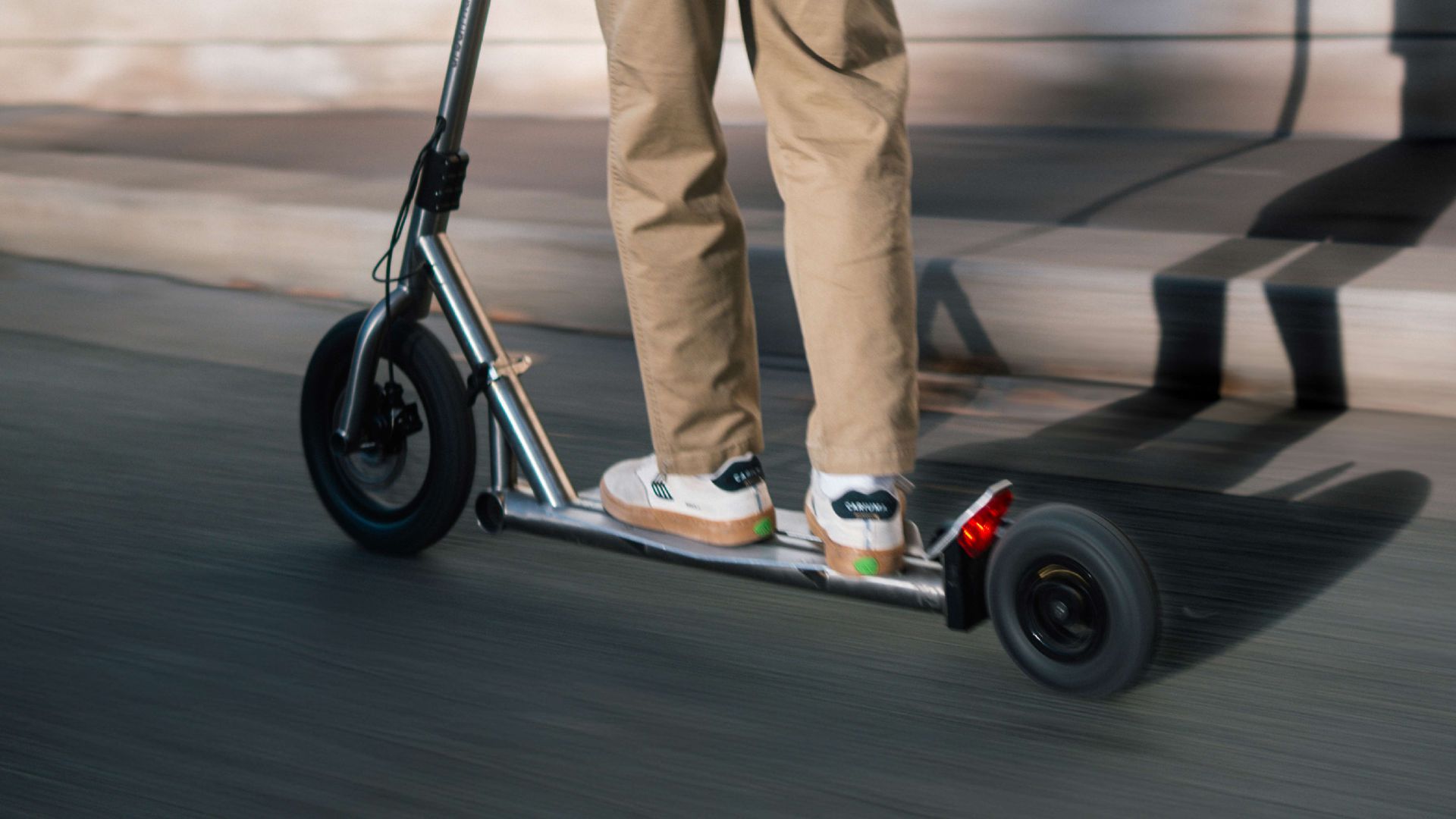 Man riding an Urban Native T9 e-scooter